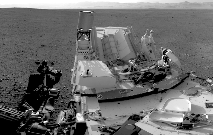 Black and white image of a rover showing machinery.