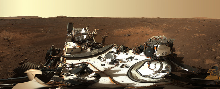 The rover and a mars panorama taken by Perseverance