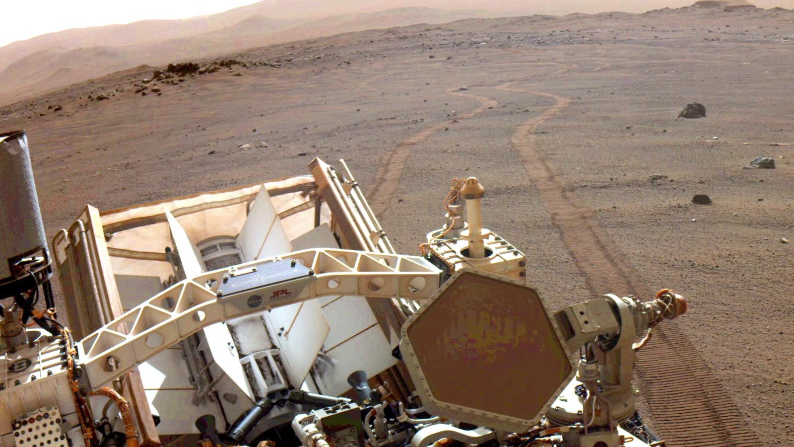 slide 2 - View of Mars with tracks left by Perseverance rover